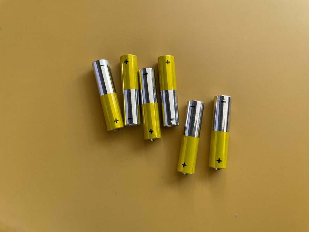 Alkaline Batteries Aaa Size On Colored Background