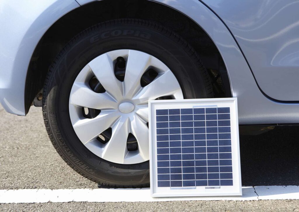 A top view of a solar panel with a battery and wires