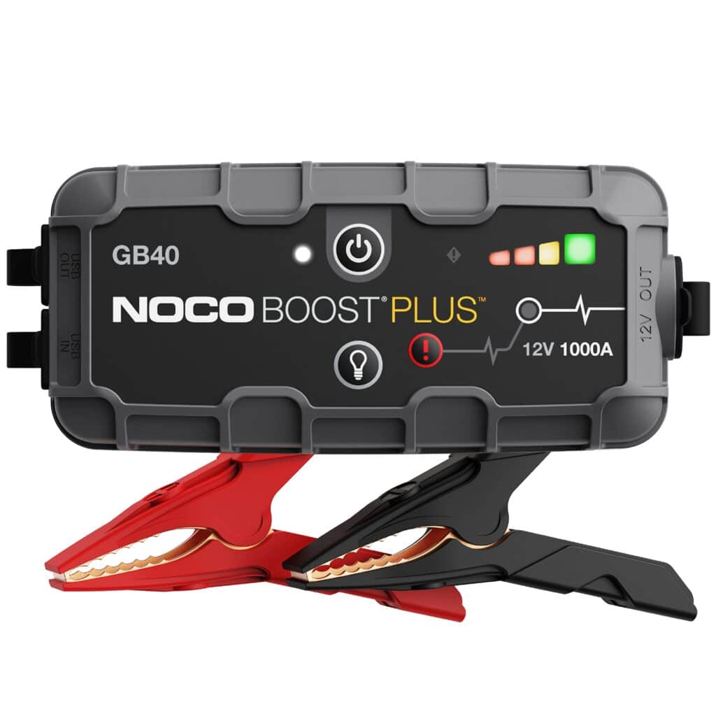 A view of the NOCO Boost Plus Car Battery Jump Starter with jumper cables