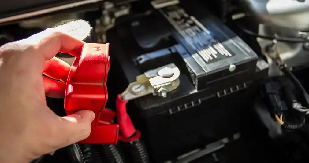 close up of a male hand checking the battery