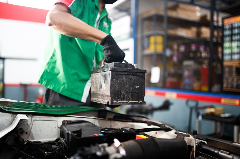 Mechanic Changing Car Battery 