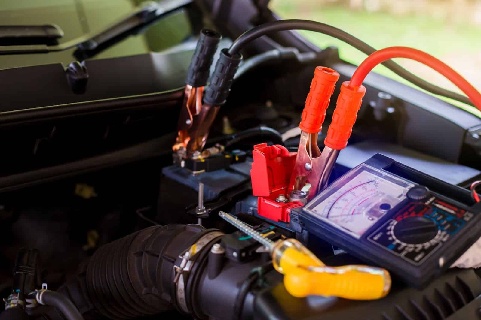 a man checking the car battery