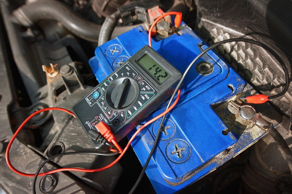 Multimeter with voltage range measurement to check up voltage level of the car battery