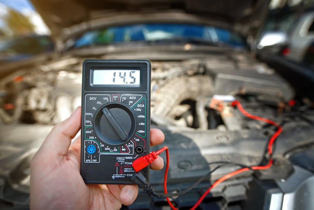 Man Test Car Alternator And Check Car Battery Voltage With